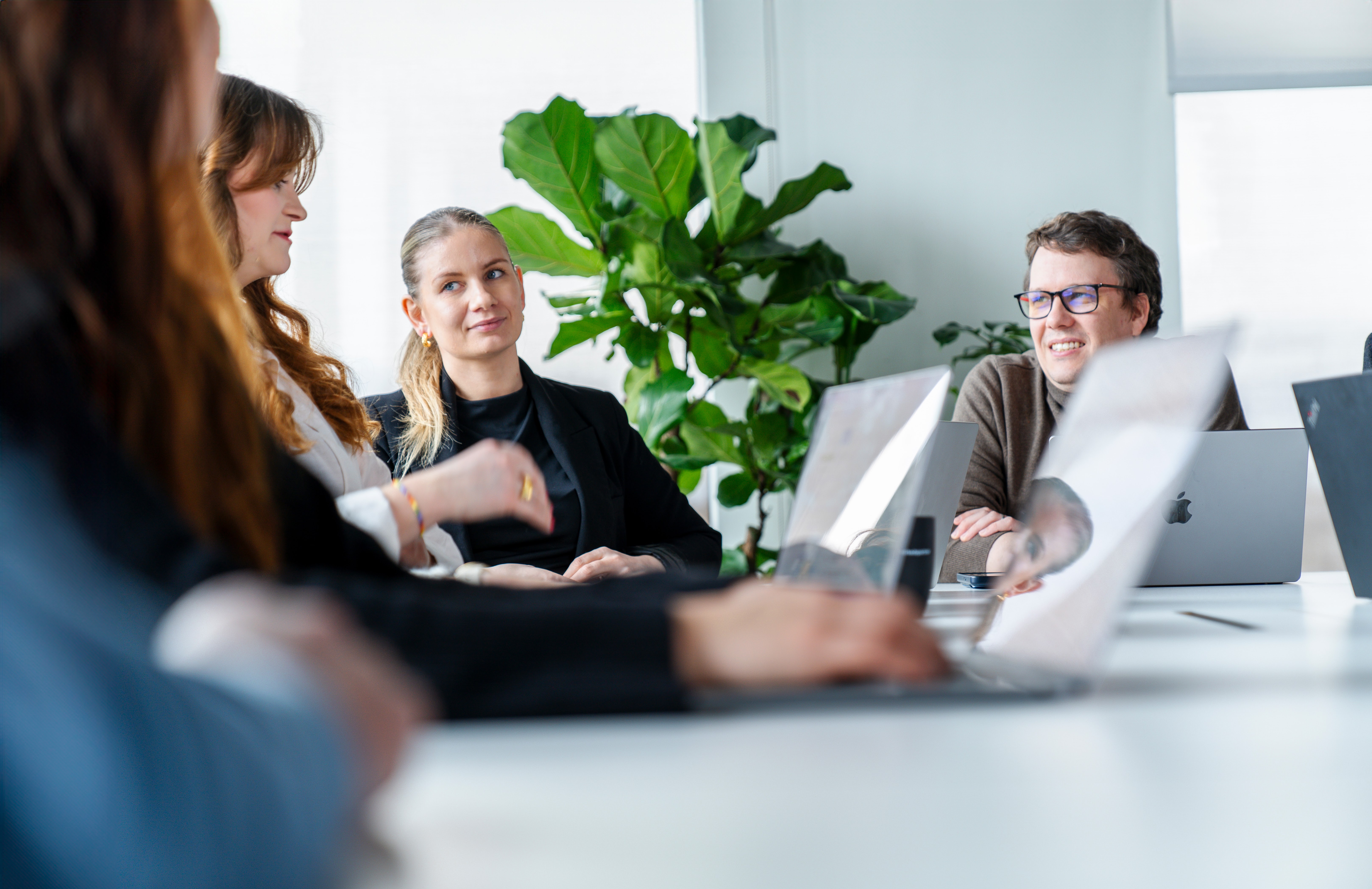 People around a meeting table