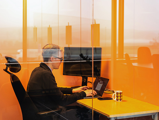 Intuvio employee working by PC